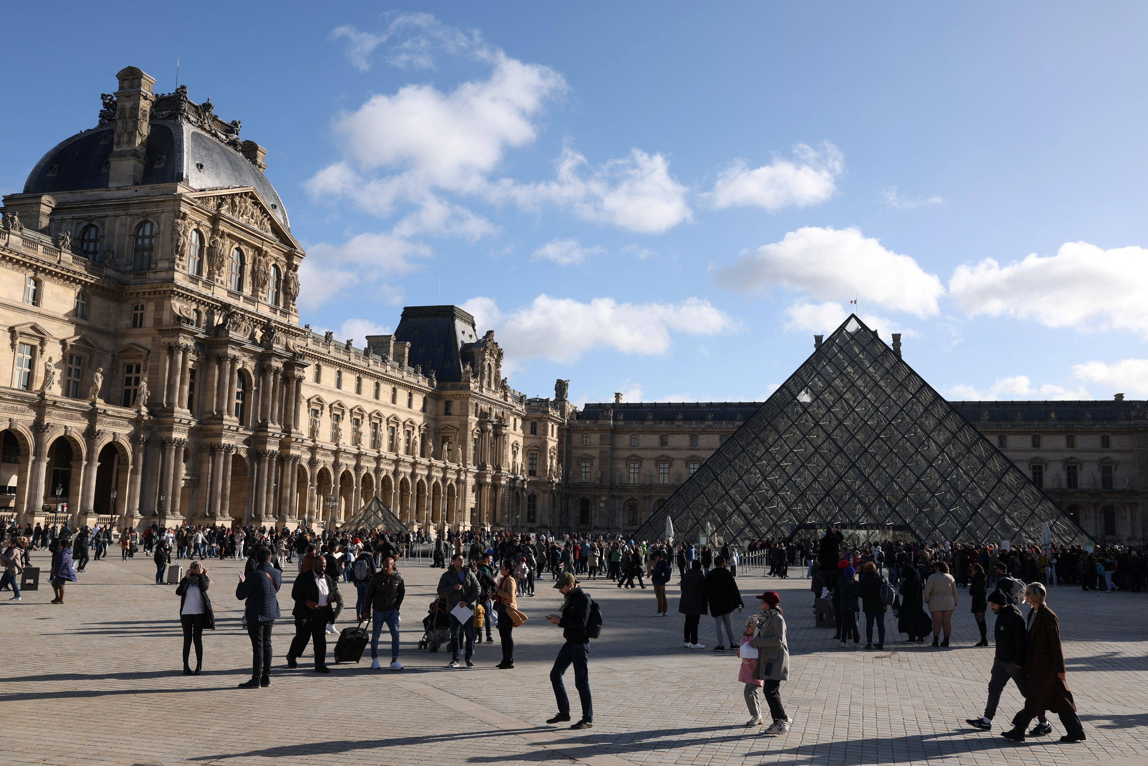 Tourists at the Louvre Museum in Paris