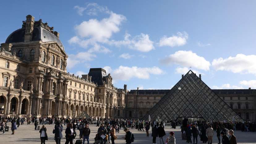 Tourists at the Louvre Museum in Paris