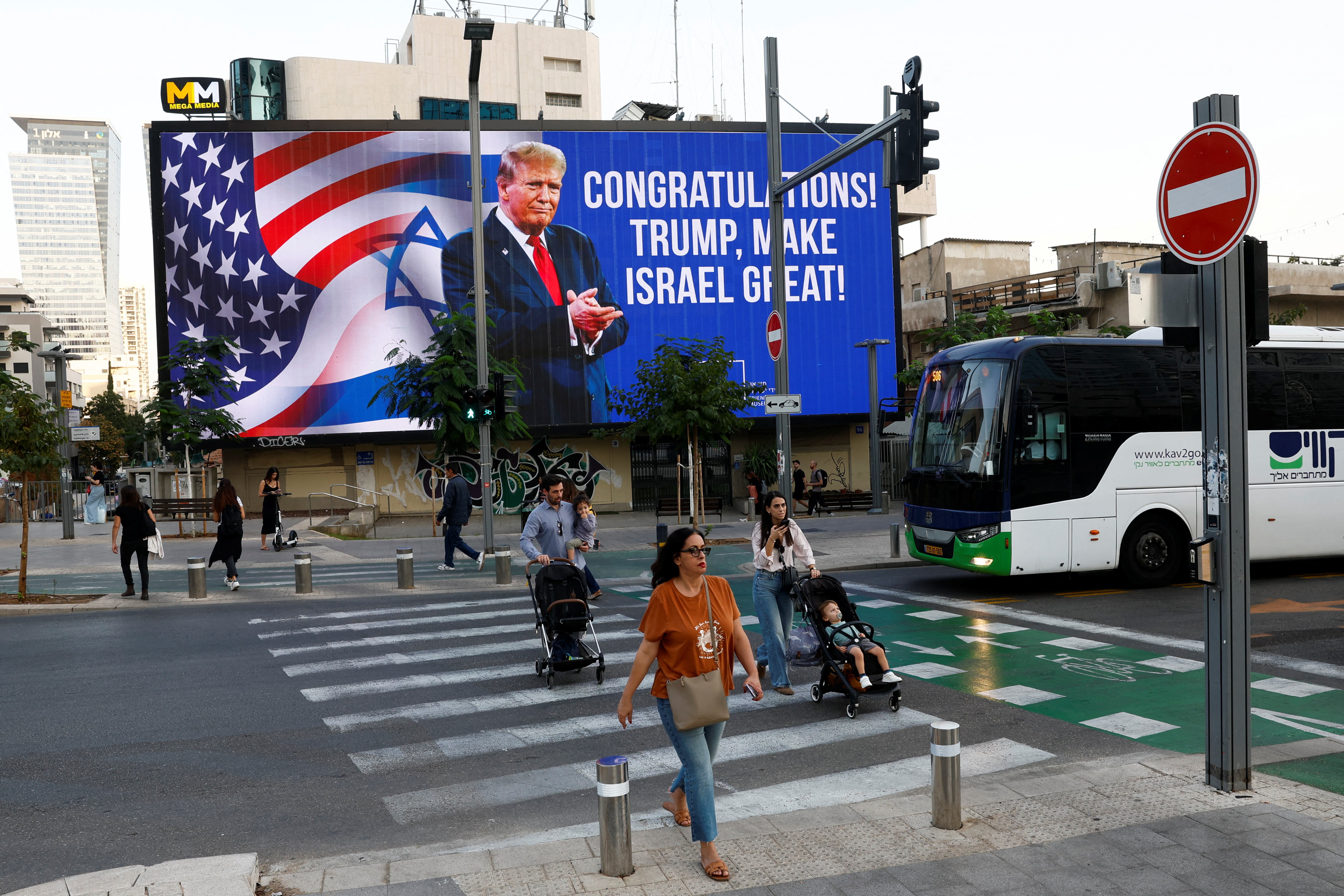 Republican presidential nominee and former U.S. President Donald Trump appears on a congratulatory billboard for the 2024 U.S Presidential Election, in Tel Aviv