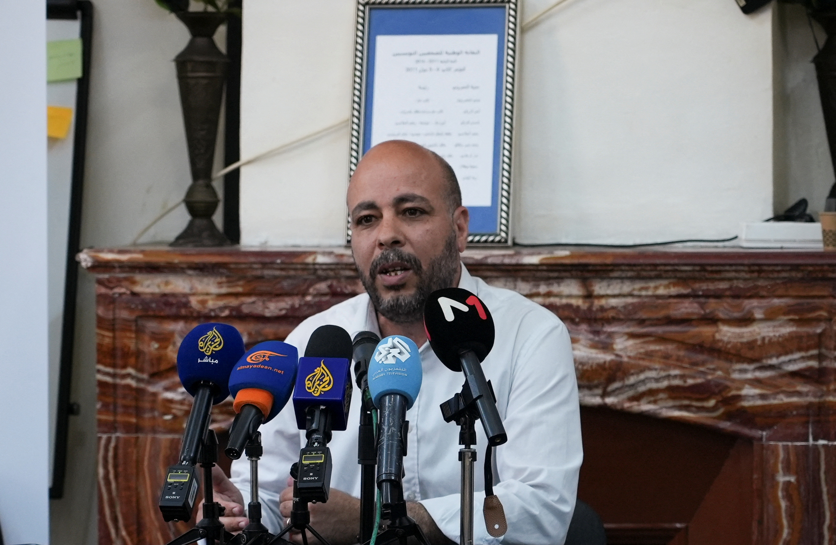 Romdhane Ben Amor of the Tunisian Forum for Economic and Social Rights, an independent advocacy group attends a press conference in Tunis