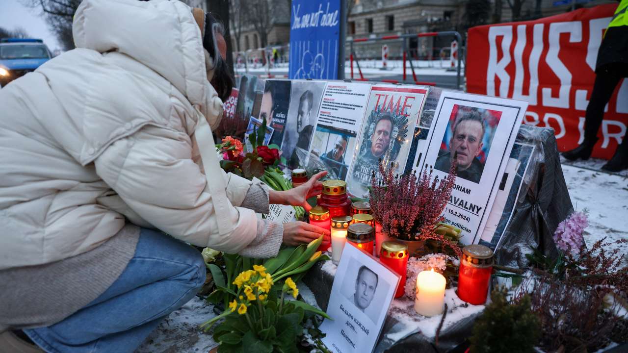 Supporters of late Kremlin critic Alexei Navalny protest outside the Russian Embassy in Berlin