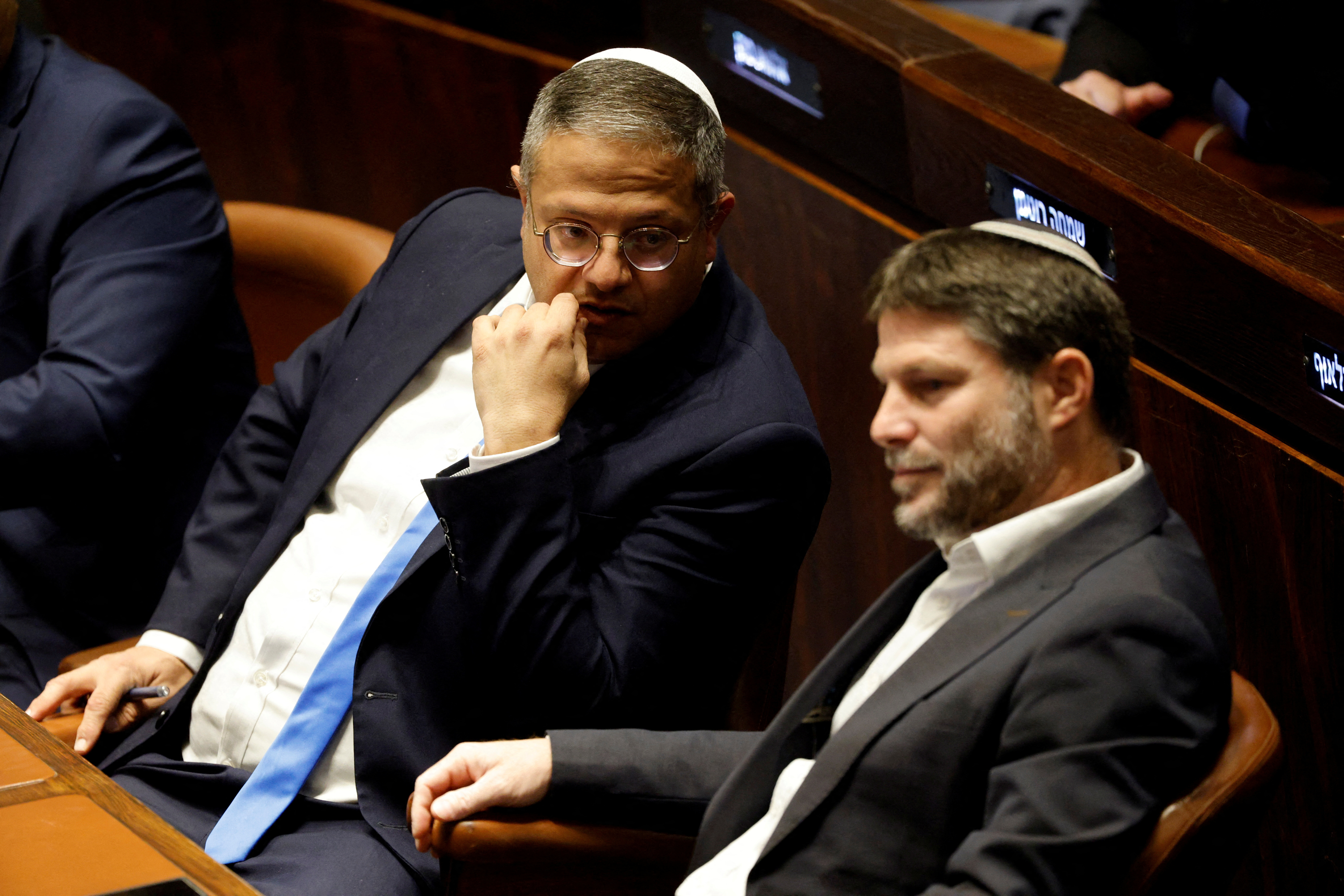 FILE PHOTO: Right-wing Knesset members Itamar Ben-Gvir and Bezalel Smotrich attend a special session at the Knesset Israel's parliament, to approve and swear in a new right-wing government, in Jerusalem