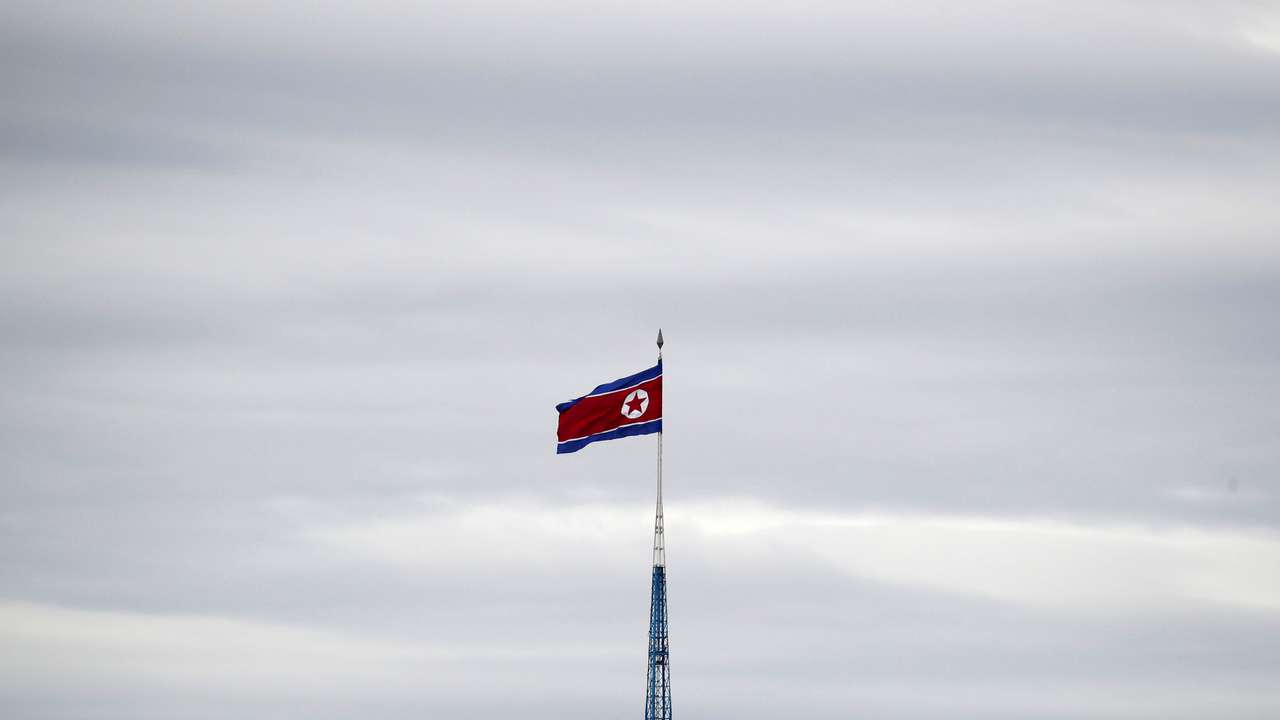 A North Korean flag flutters on top of a 160-metre tower in North Korea's propaganda village of Gijungdong, in this picture taken from the Tae Sung freedom village near the Military Demarcation Line (MDL), in Paju