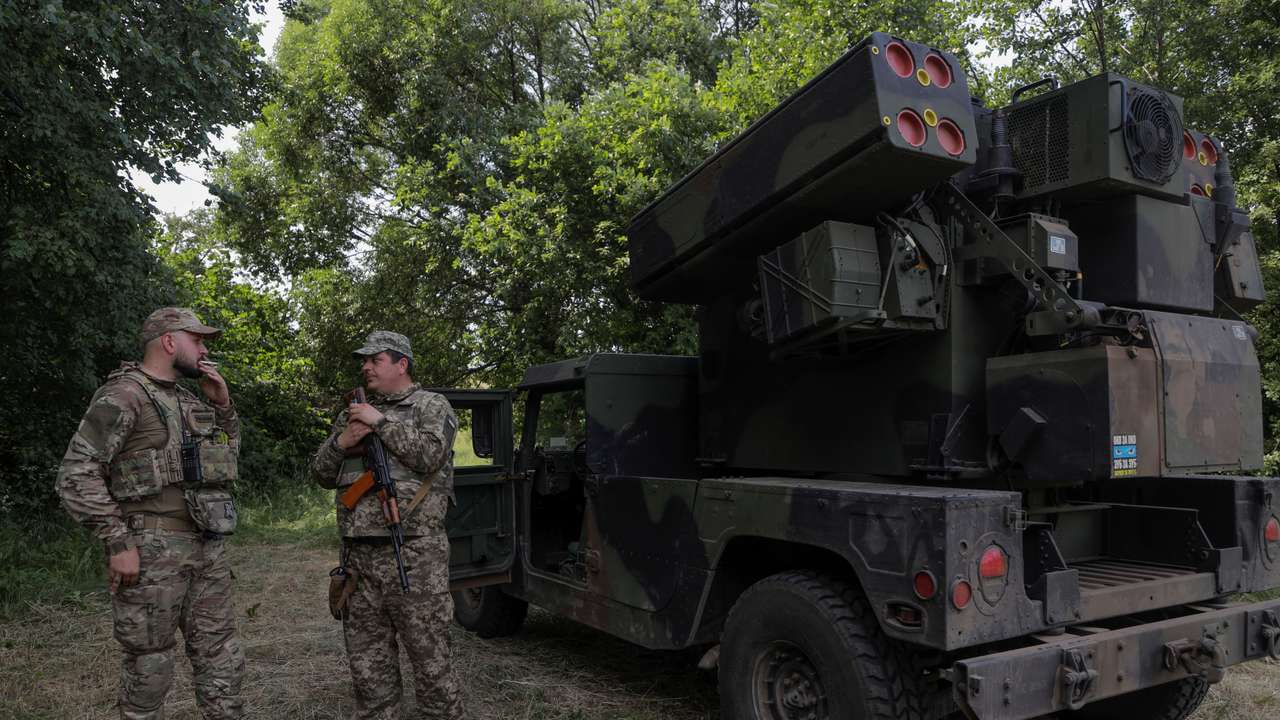 FILE PHOTO: Ukrainian servicemen stand next to an AN/TWQ-1 Avenger mobile air defence missile system outside of Kyiv