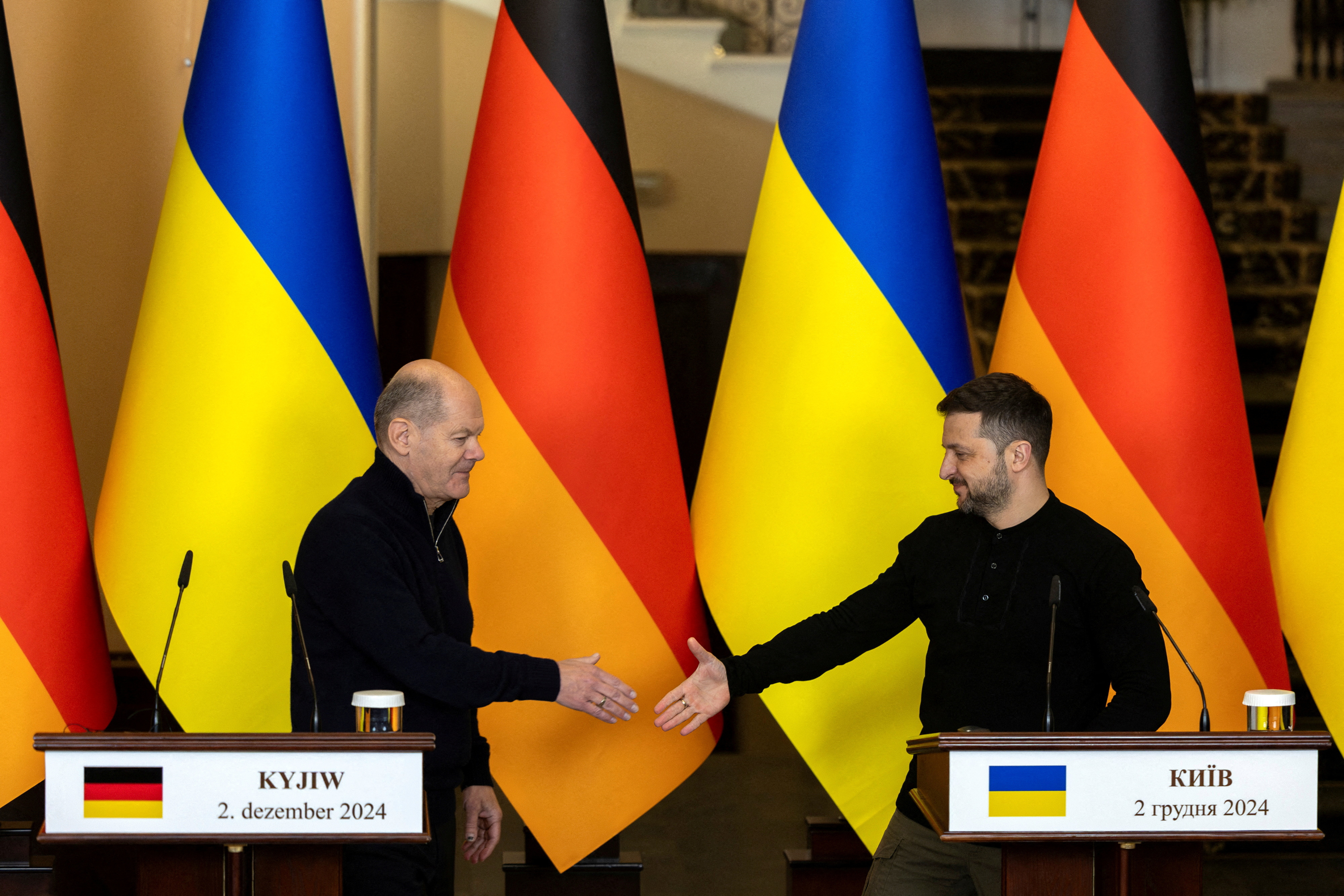 FILE PHOTO: German Chancellor Olaf Scholz meets Ukrainian President Volodymyr Zelenskiy in Kyiv
