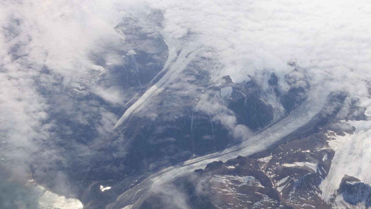 FILE PHOTO: Valleys cut by glaciers of the Greenland Ice Sheet along the mountains of Greenland
