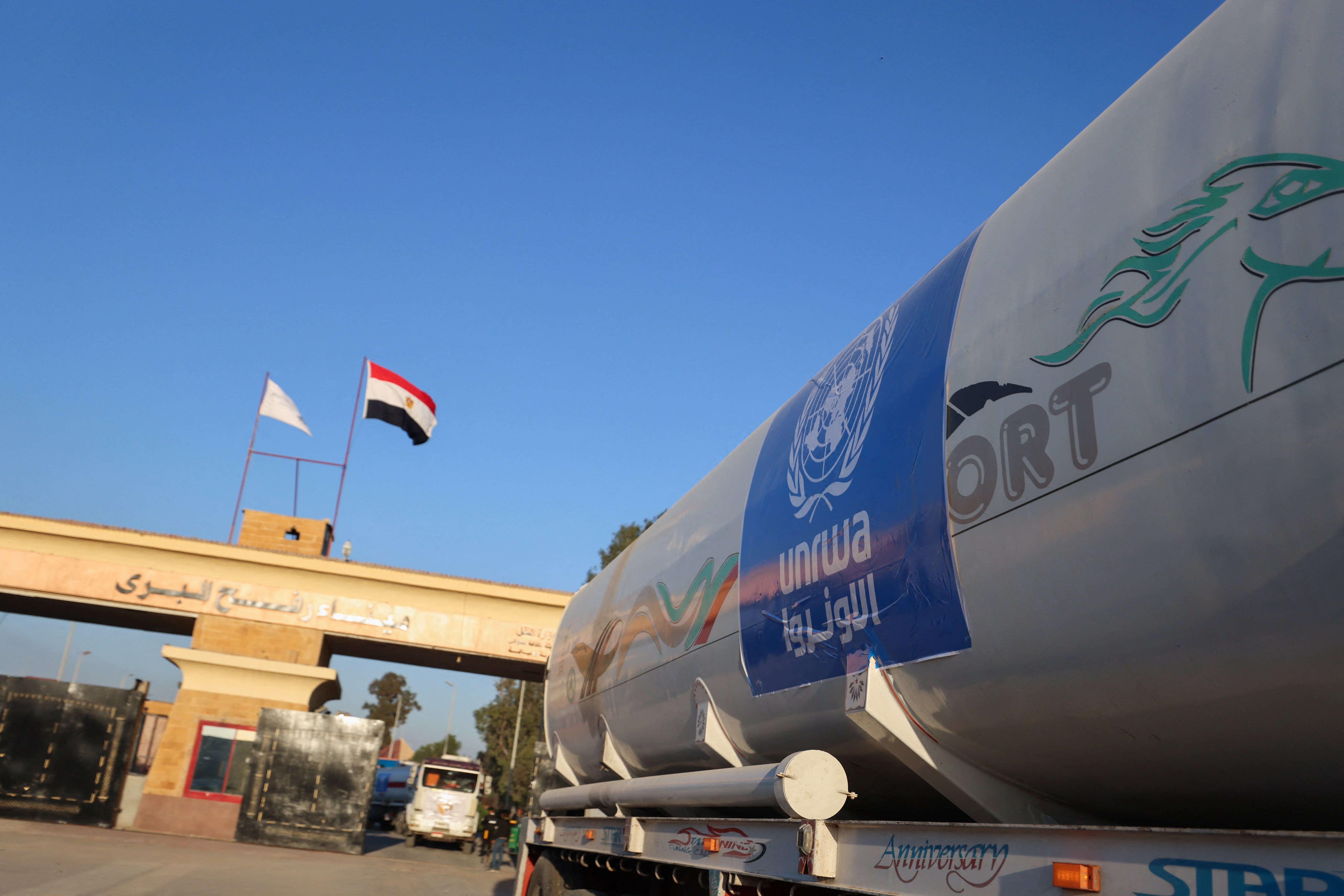 Ambulances drive on the Egyptian side of the Rafah border crossing between Egypt and the Gaza Strip