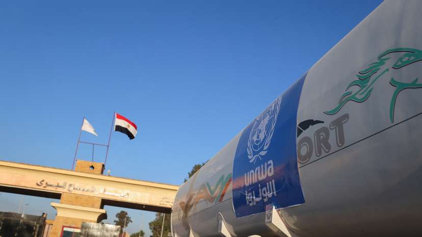 Ambulances drive on the Egyptian side of the Rafah border crossing between Egypt and the Gaza Strip