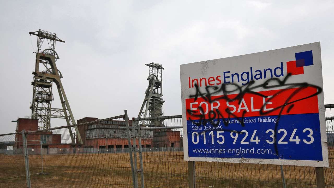 A for sale sign stands by the closed Clipstone Colliery in Clipstone near Mansfield
