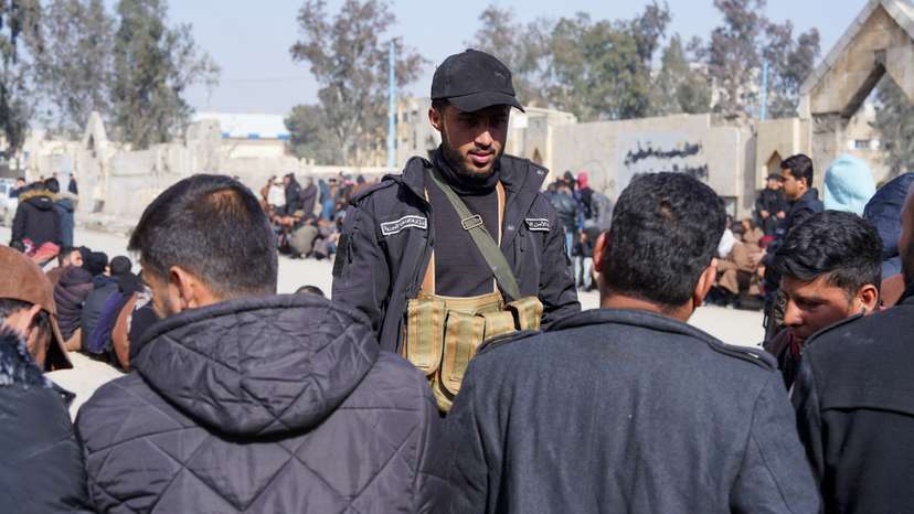 Members of the Kurdish-led Syrian Democratic Forces (SDF) queue to settle their status with Syrian government in Raqqa