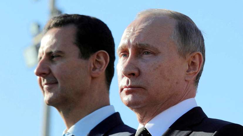 FILE PHOTO: Russian President Putin and Syrian President Bashar al-Assad visit the Hmeymim air base in Latakia Province