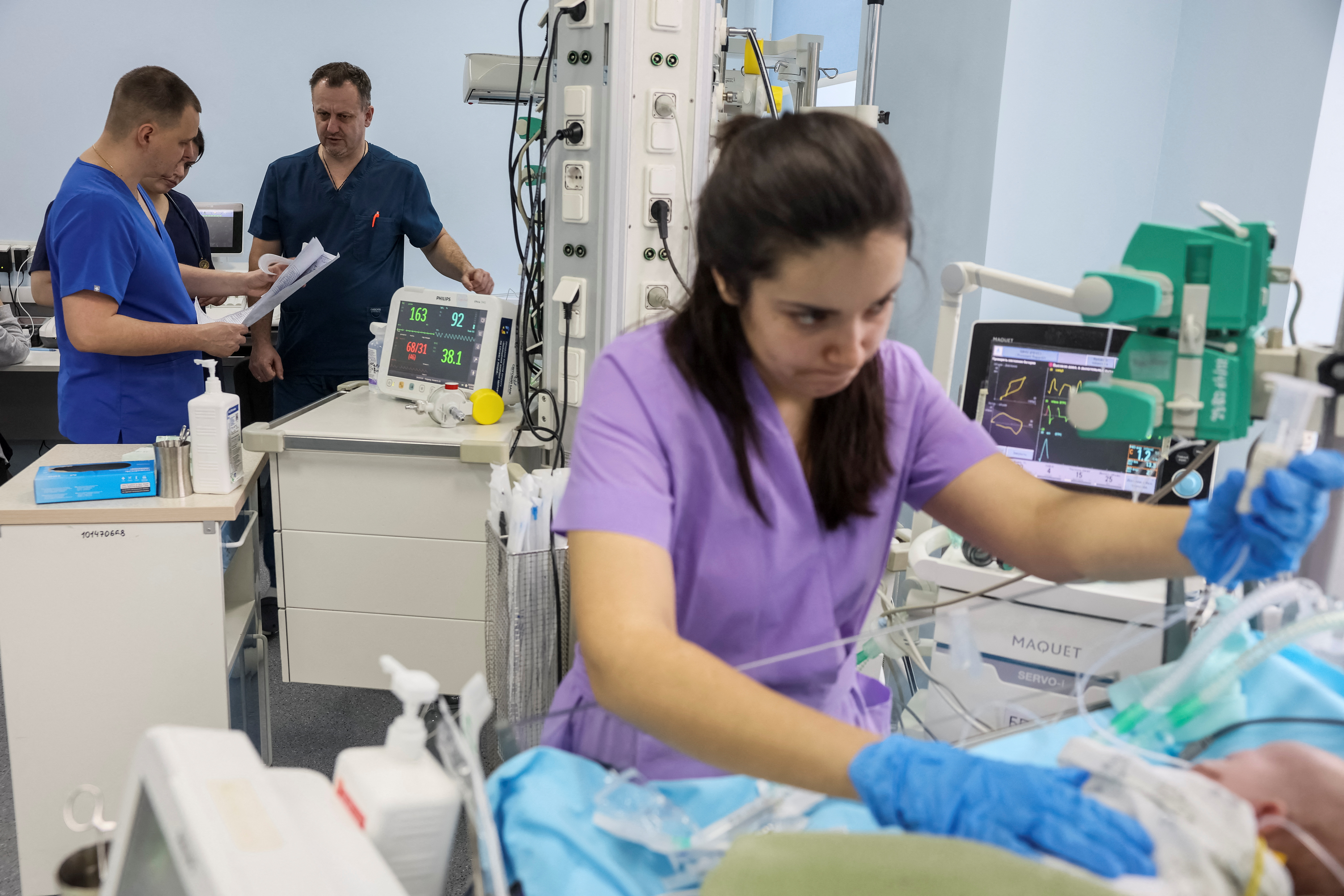 Tkachuk, head of neonatal intensive care unit checks patients in the Centre for Paediatric Cardiology and Cardiac Surgery in Kyiv