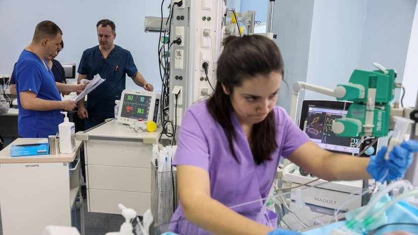 Tkachuk, head of neonatal intensive care unit checks patients in the Centre for Paediatric Cardiology and Cardiac Surgery in Kyiv