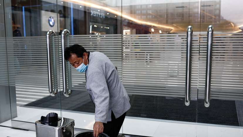 Cleaning worker Hu works at a shopping mall in Beijing