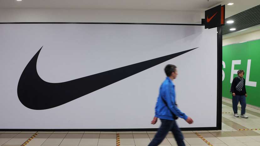 People walk past a closed store of Nike in Saint Petersburg