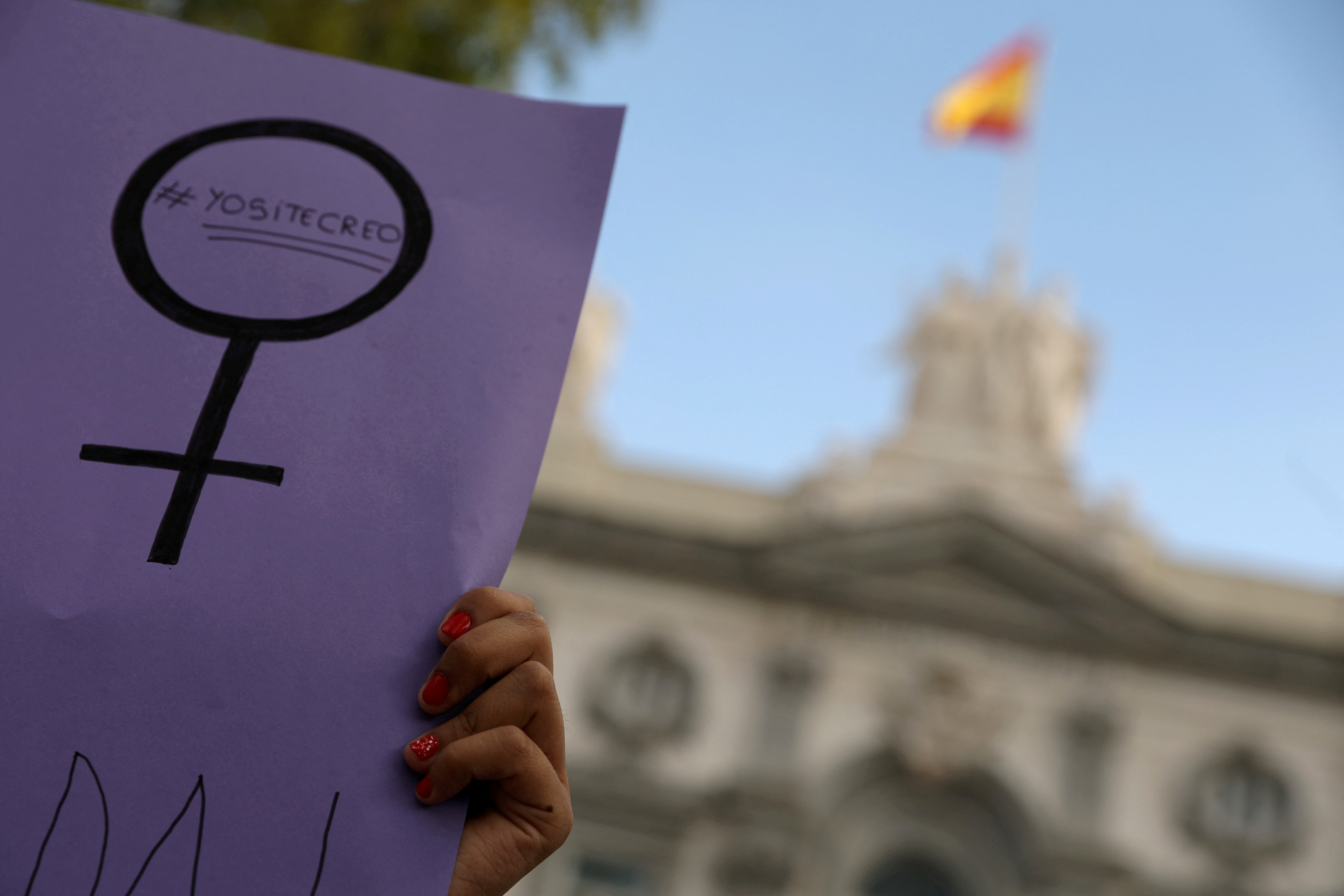 FILE PHOTO: Women gather outside the Supreme Court after Spain's top court found five men known as the "Wolf Pack" guilty of rape in Madrid