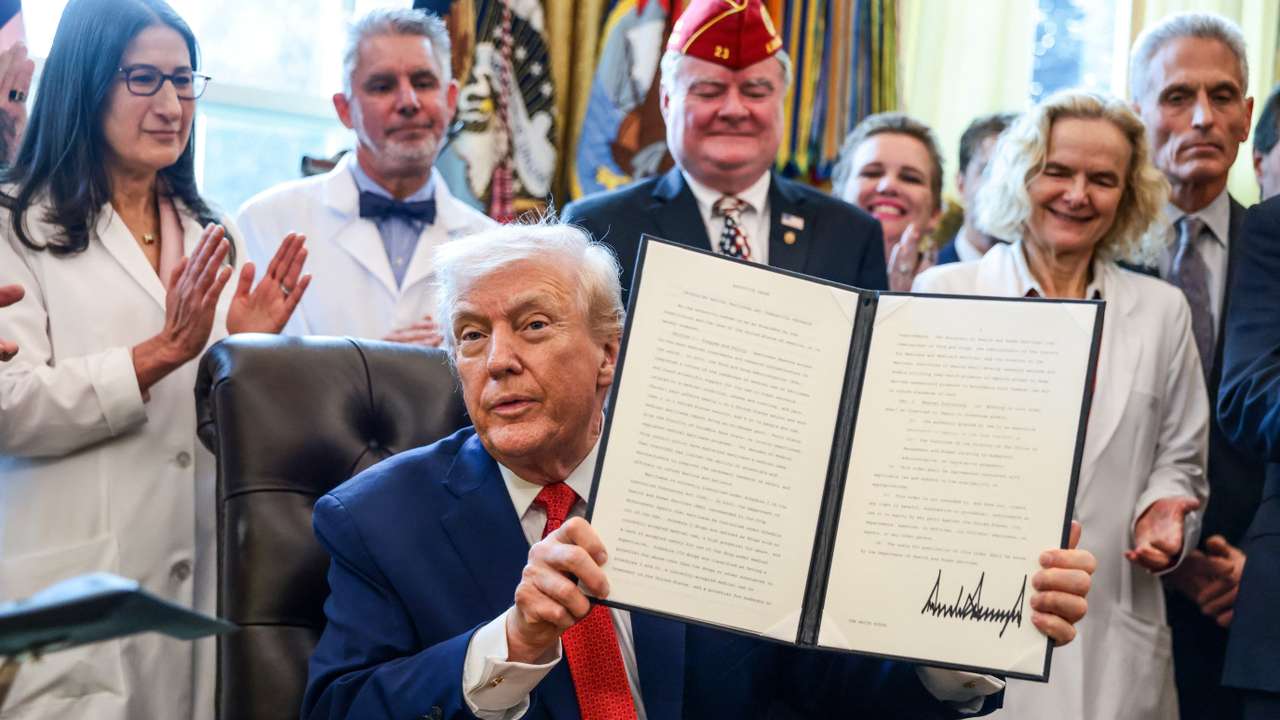 U.S. President Trump signs executive orders at the Oval Office, in Washington