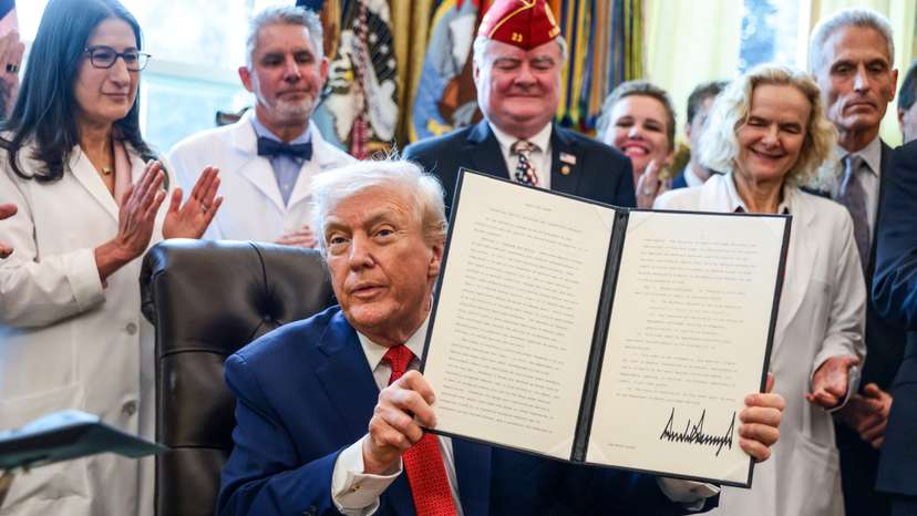 U.S. President Trump signs executive orders at the Oval Office, in Washington