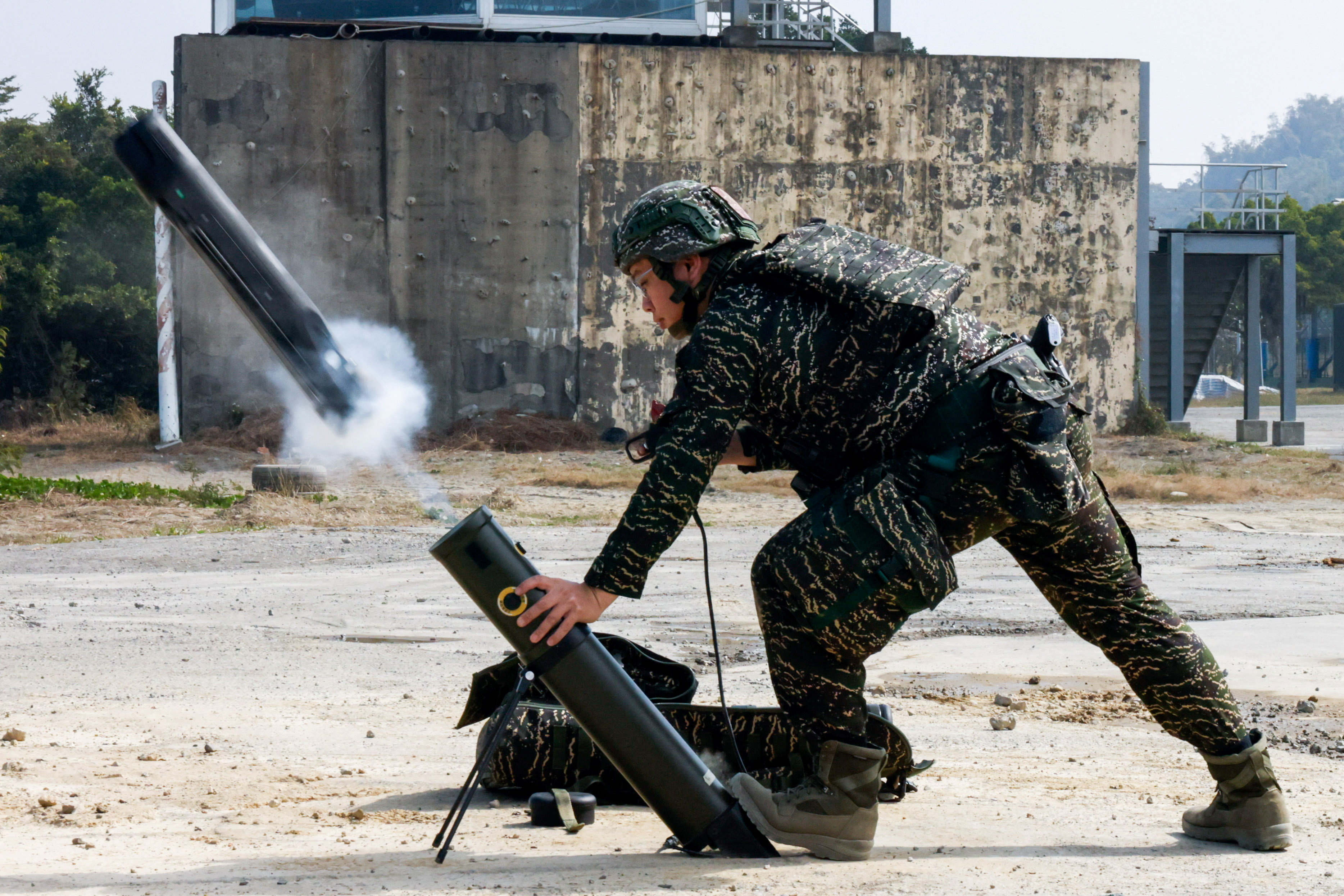 Soldiers operate a Taiwan-made attack drone during an annual military exercise ahead of the Lunar New Year in Kaohsiung