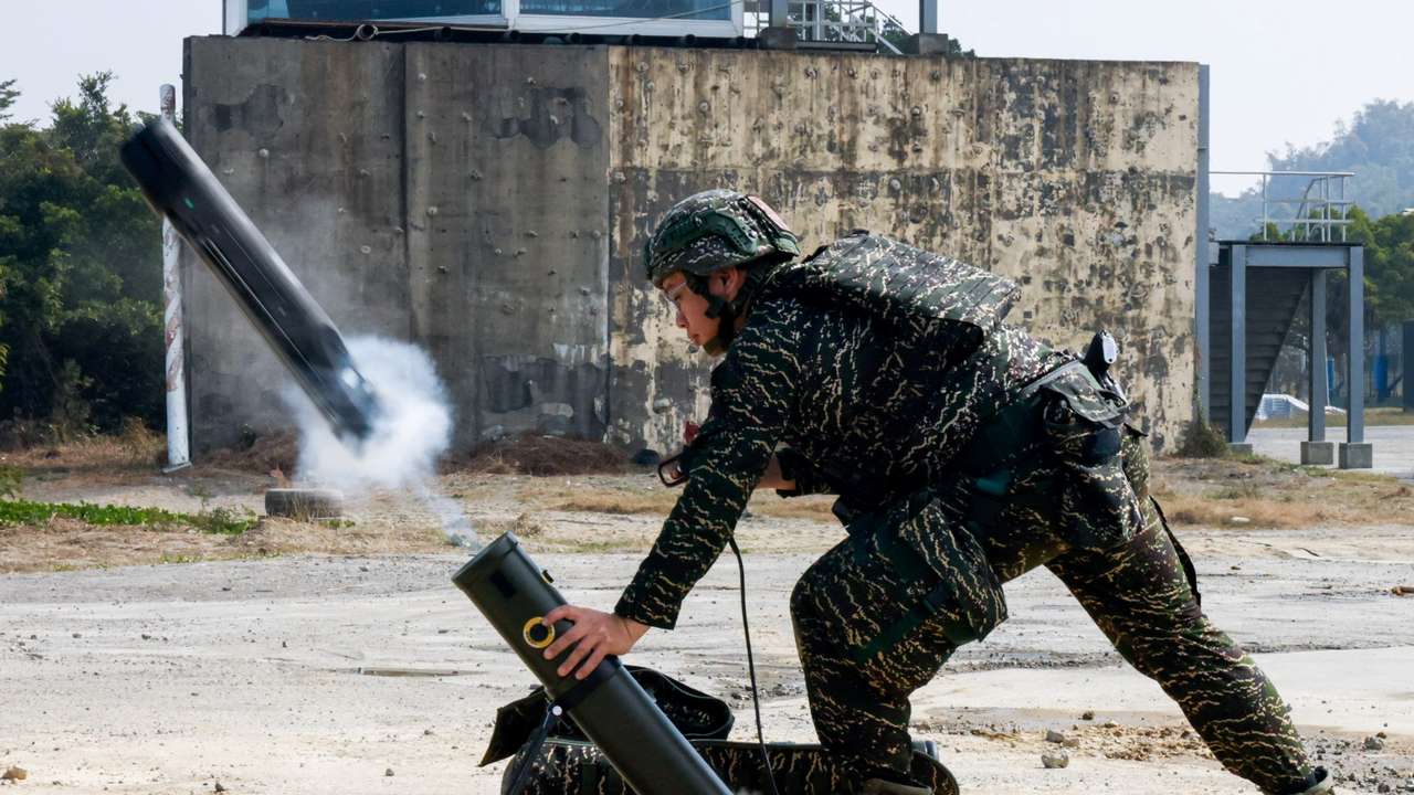 Soldiers operate a Taiwan-made attack drone during an annual military exercise ahead of the Lunar New Year in Kaohsiung