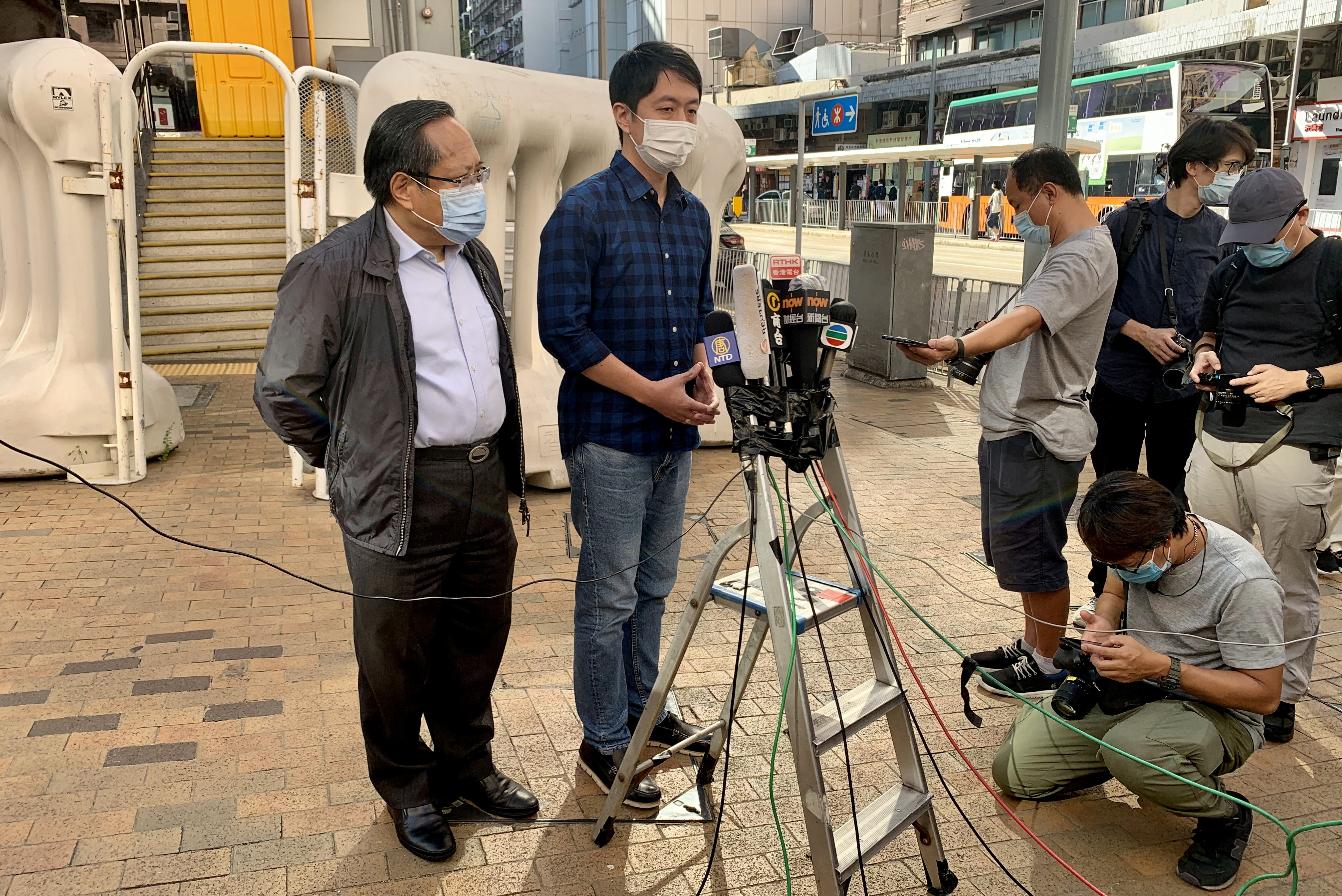 Former lawmaker Ted Hui Chi-fung speaks to members of the media in Hong Kong