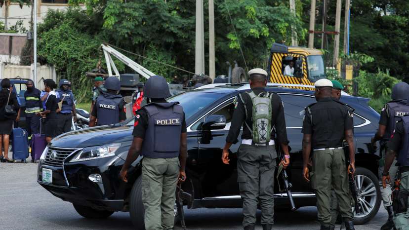 FILE PHOTO: Police officers are seen conducting checks on vehicles at the Federal High court in Abuja