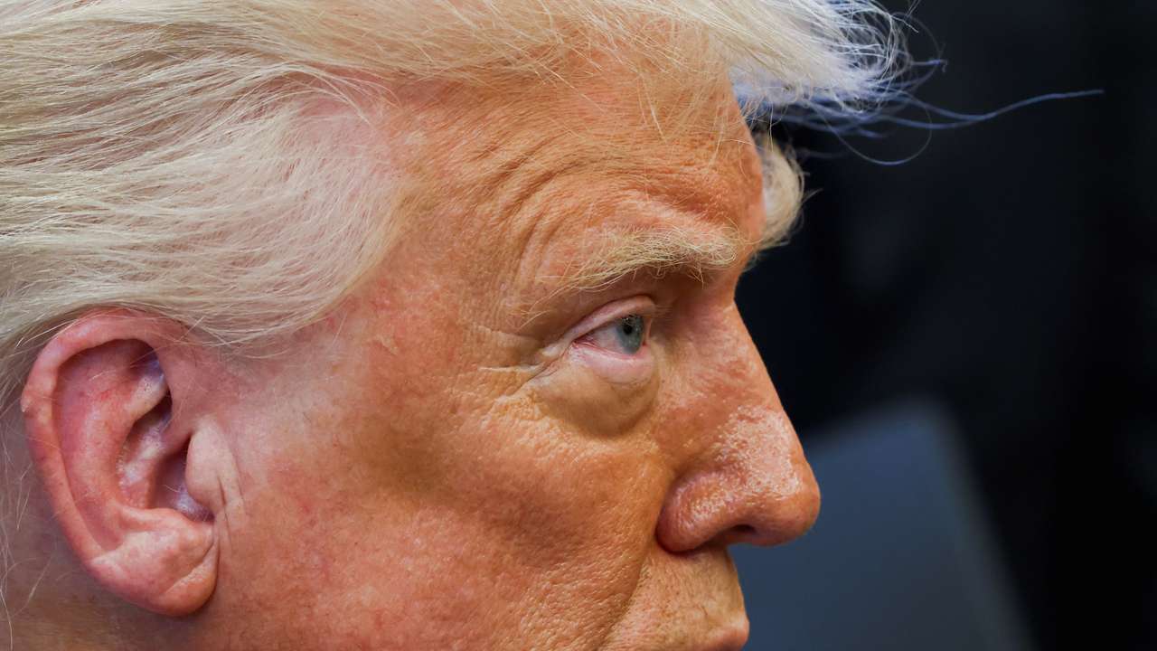 U.S. President Donald Trump signs executive orders in the Oval Office at the White House