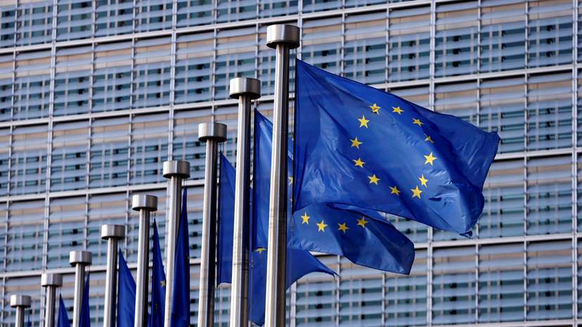 FILE PHOTO: EU flags flutter outside the EU Commission headquarters in Brussels