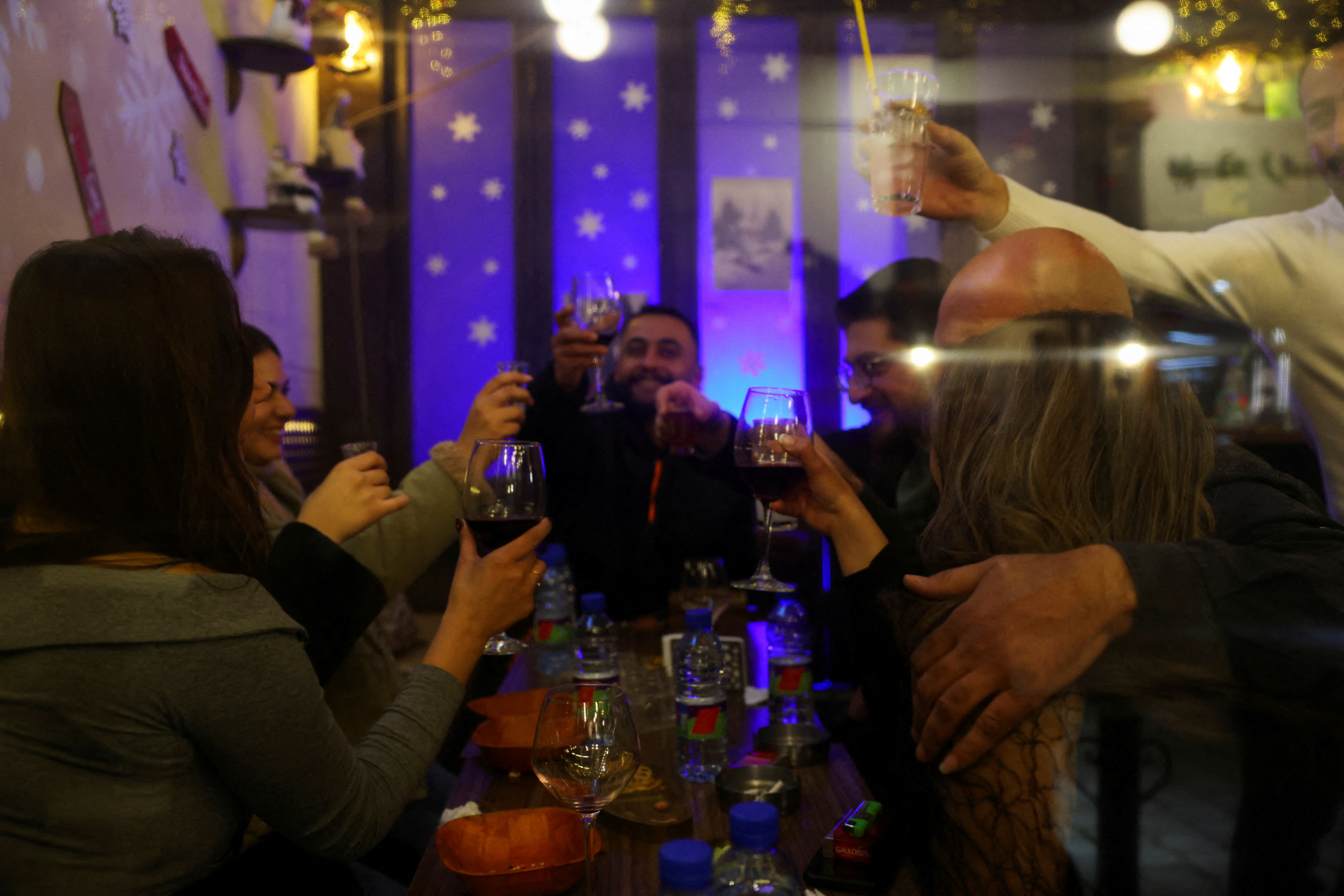 FILE PHOTO: People enjoy a night out in the Bab Touma neighbourhood of the Old City of Damascus