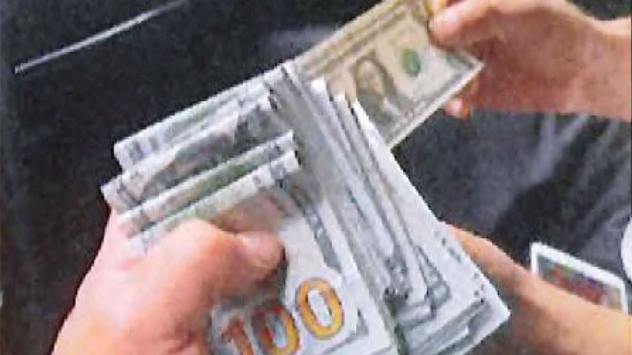 An undercover U.S. law enforcement officer is handed $15,000 in murder plot in New York