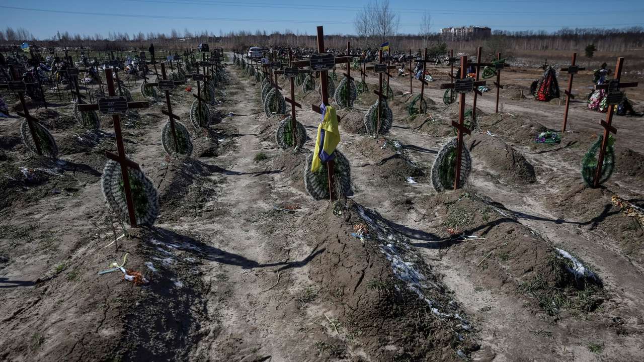 FILE PHOTO: Graves of unidentified people killed by Russian soldiers during occupation of the Bucha town, are seen at the town's cemetery outside Kyiv