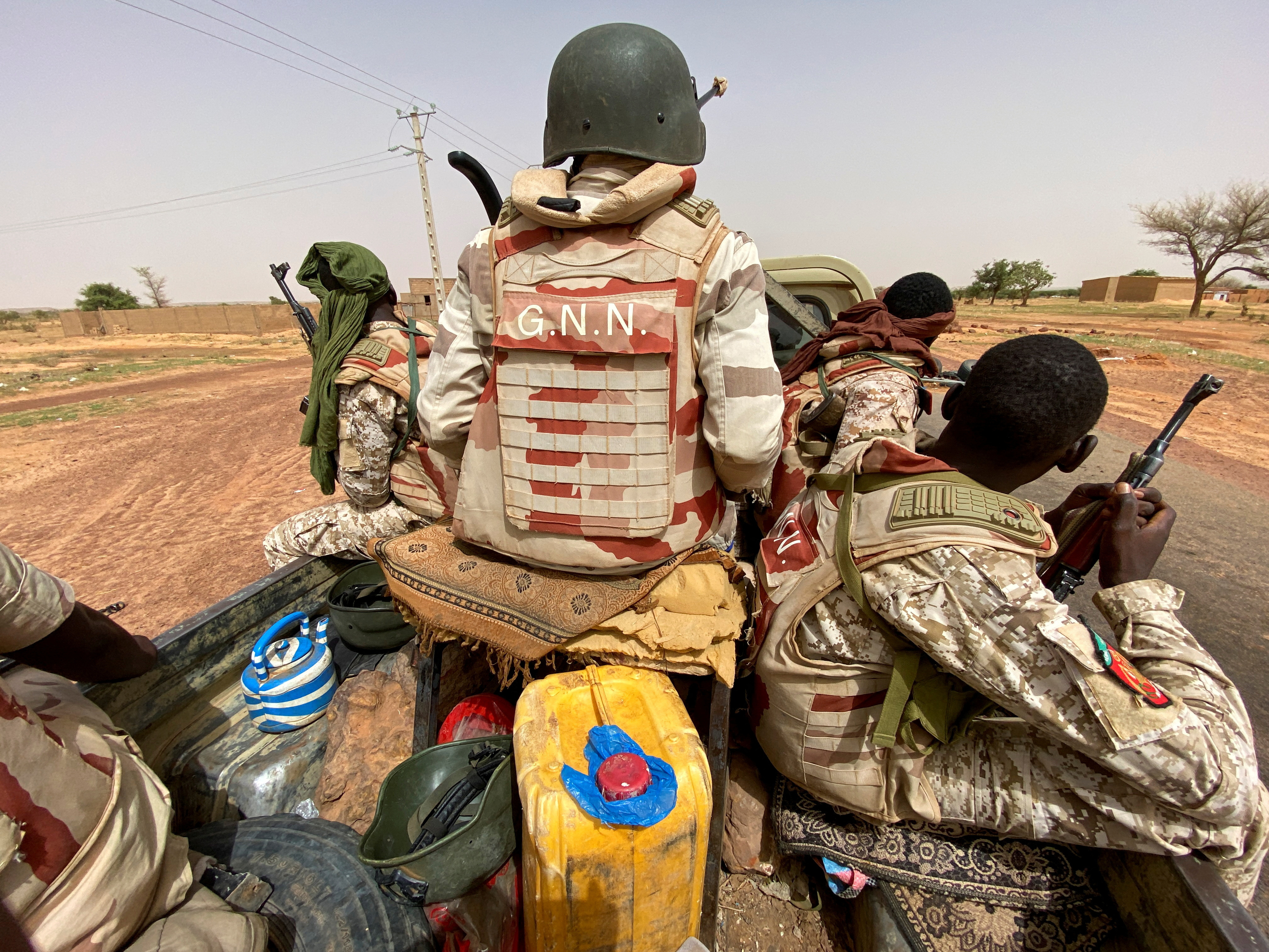FILE PHOTO: A convoy of Nigerien soldiers patrol outside the town of Ouallam, Niger