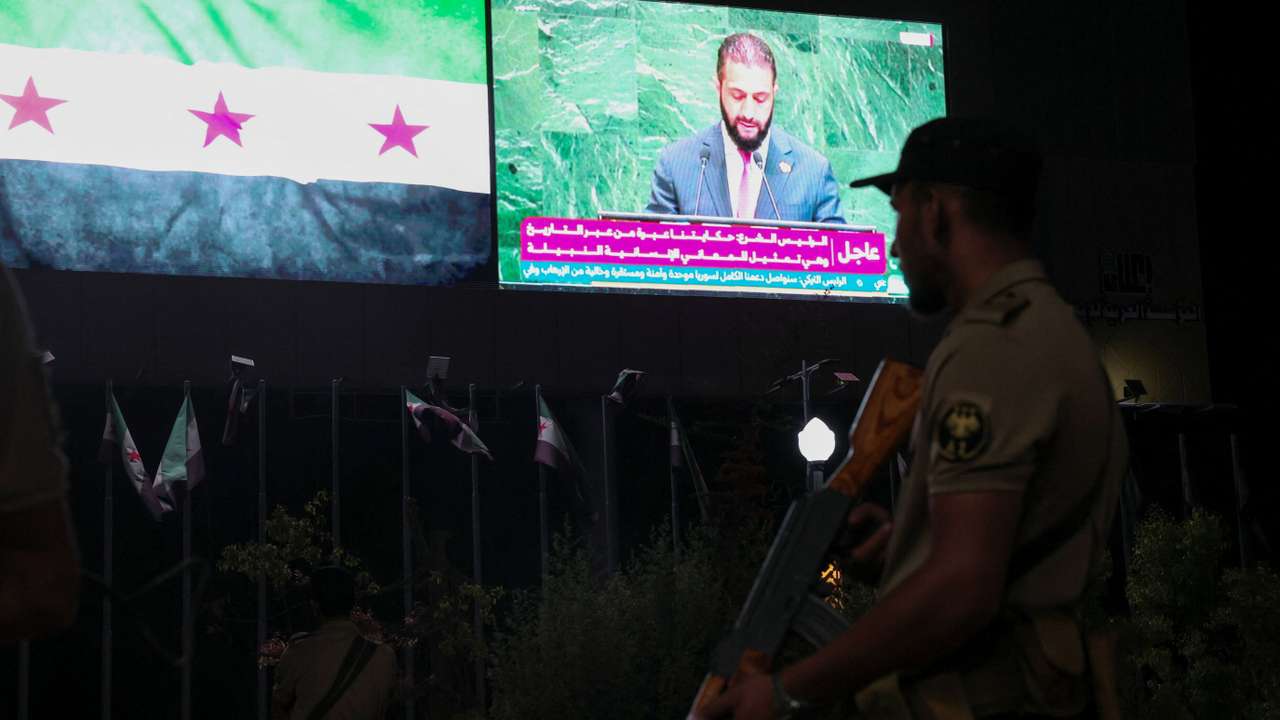 A member of the Syrian security forces stands during President Ahmad al-Sharaa's address at the United Nations General Assembly meeting, in Aleppo