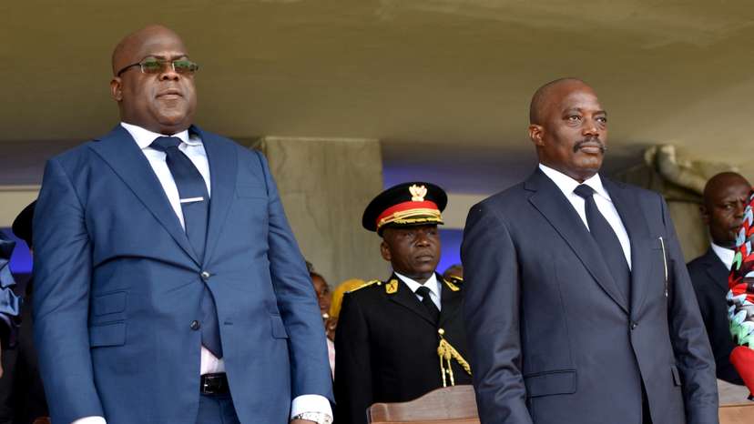 FILE PHOTO: Democratic Republic of Congo's outgoing President Joseph Kabila and his successor Felix Tshisekedi stand during an inauguration ceremony in Kinshasa
