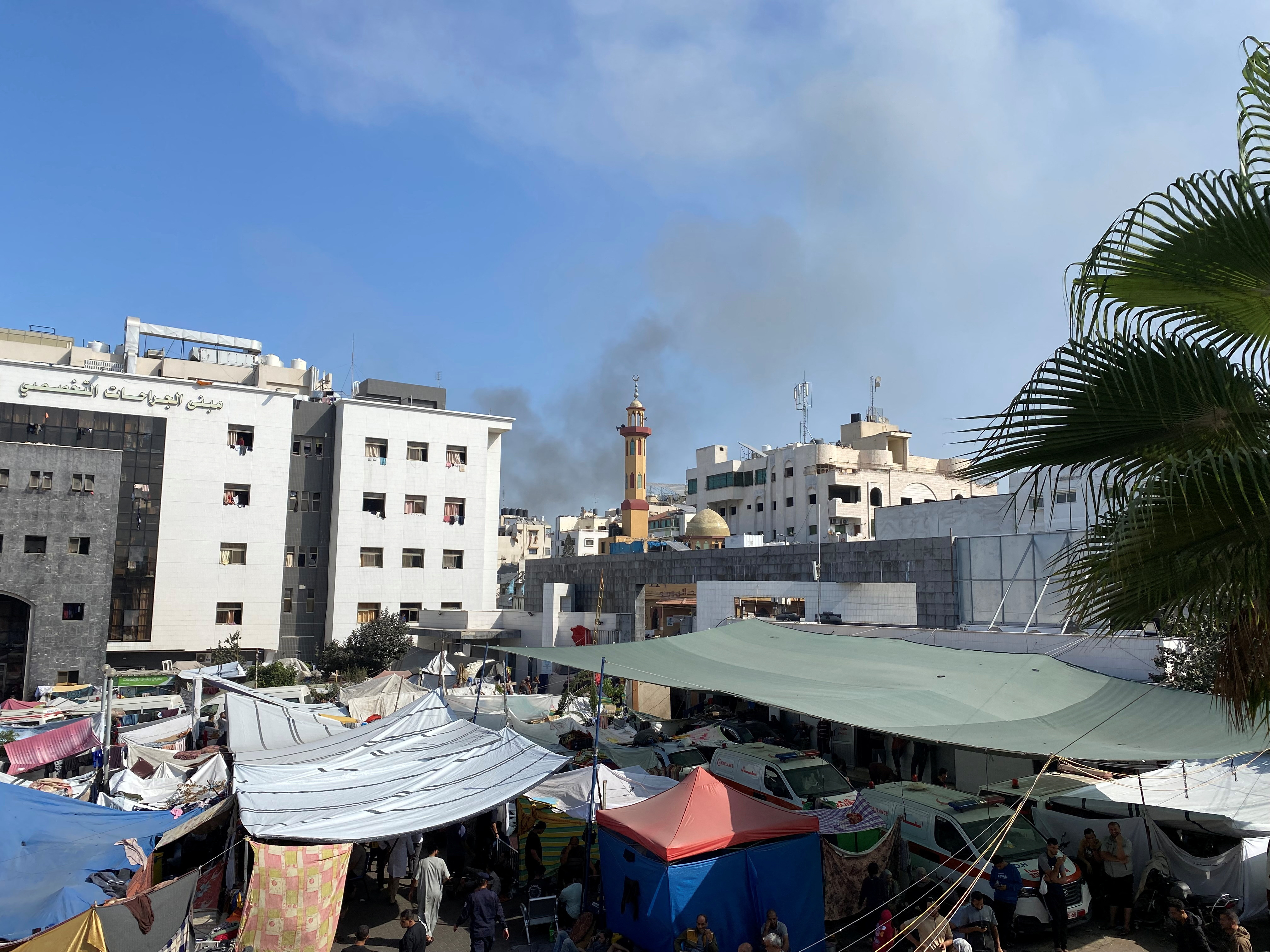 FILE PHOTO: Smoke rises as displaced Palestinians take shelter at Al Shifa hospital, amid the ongoing conflict between Hamas and Israel, in Gaza City
