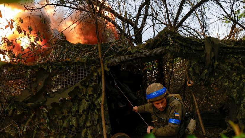 Ukrainian National Guard 'Khartiia' brigade service member and a D-20 howitzer crew commander Ivan Liashko fires towards Russian troops in a front line in Kharkiv region