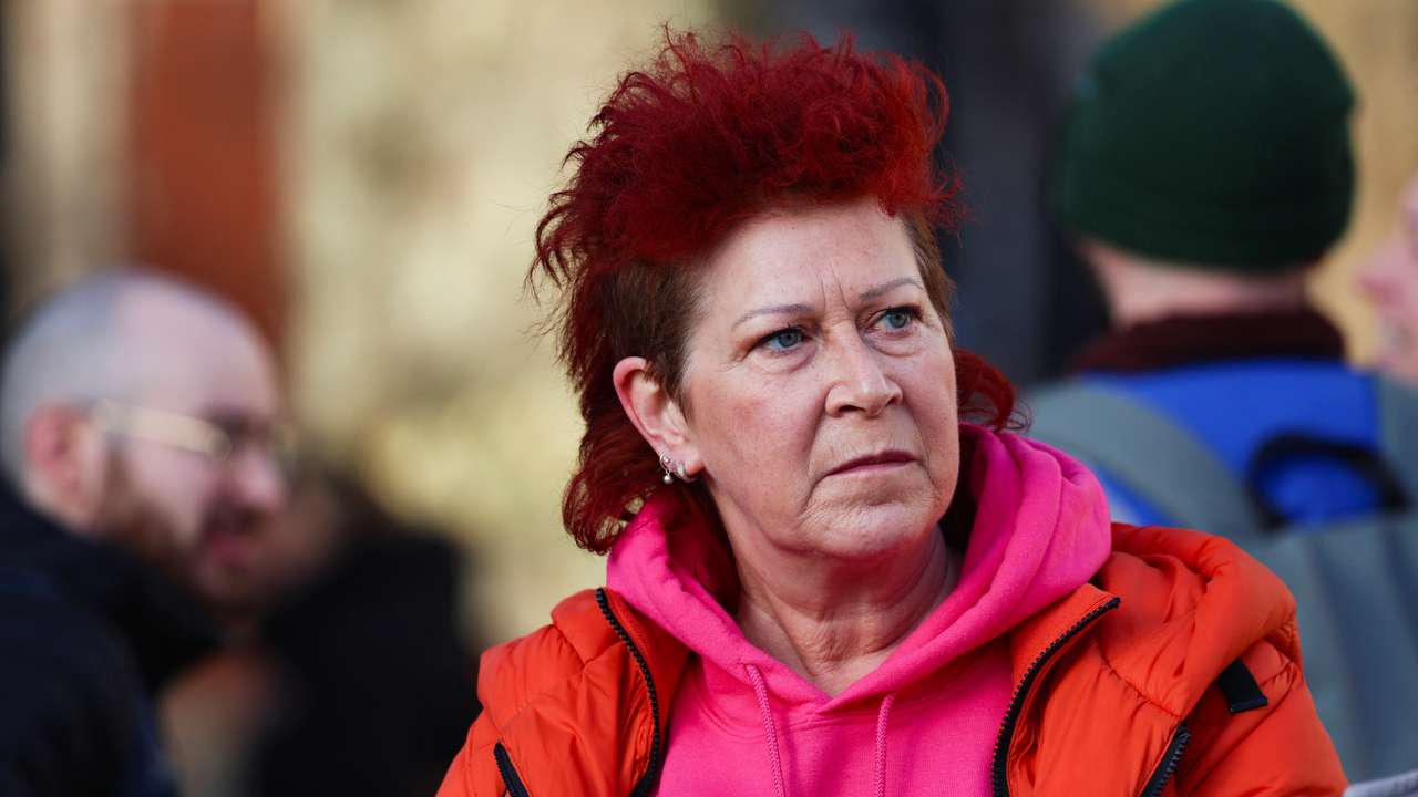 Jenny Carruthers waits in Parliament Square while British lawmakers debate whether to allow assisted dying for terminally ill adults, in London