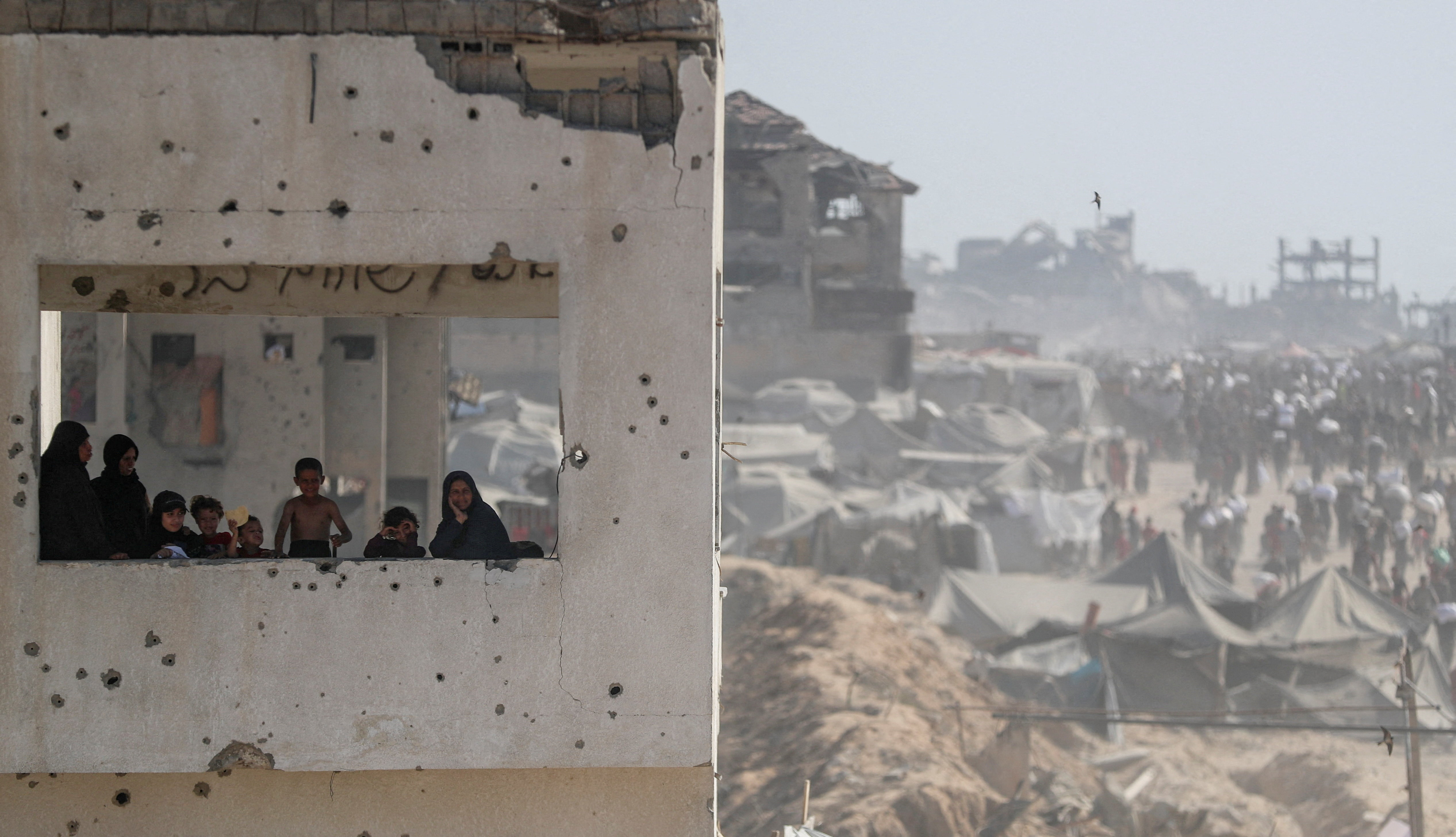 Palestinians carry aid supplies that entered Gaza through Israel, in Beit Lahia