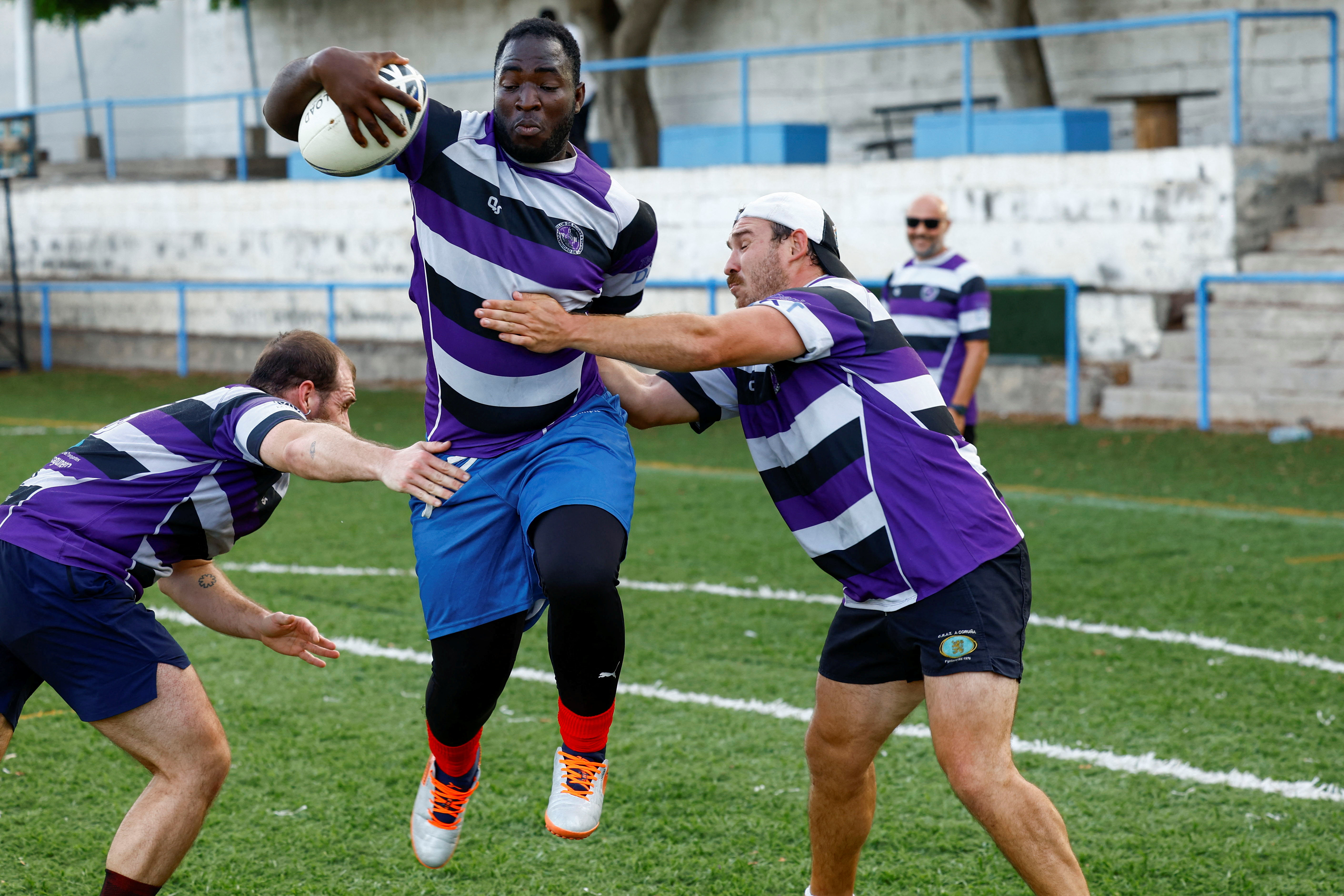 Moussa Diaby, 20, a migrant from Mali, trains during the first day of training with his new rugby team Crull