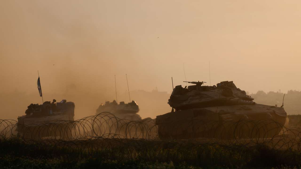 Israeli military vehicles manoeuvre on the border with southern Gaza