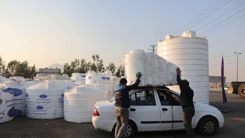 People shop water storage tanks following a drought crisis in Tehran