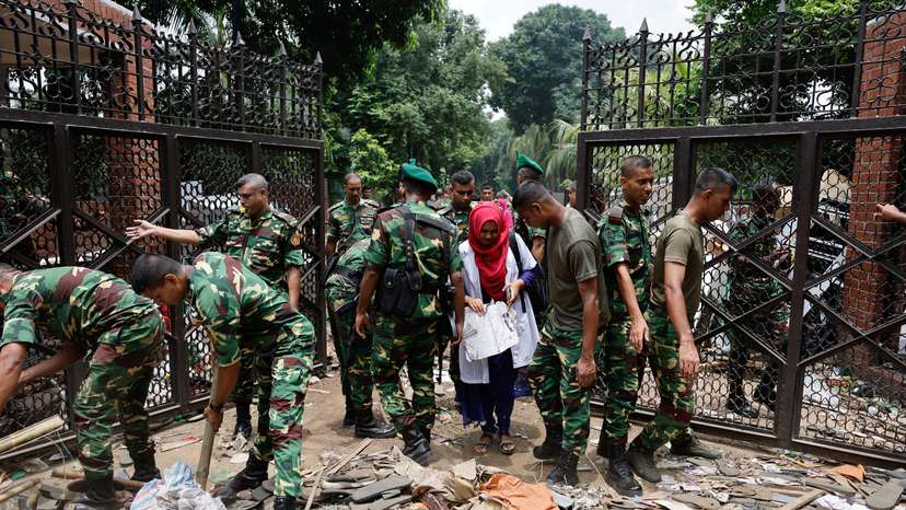 FILE PHOTO: Army members clear an entrance of the Ganabhaban after Bangladeshi PM Hasina's resignation, in Dhaka