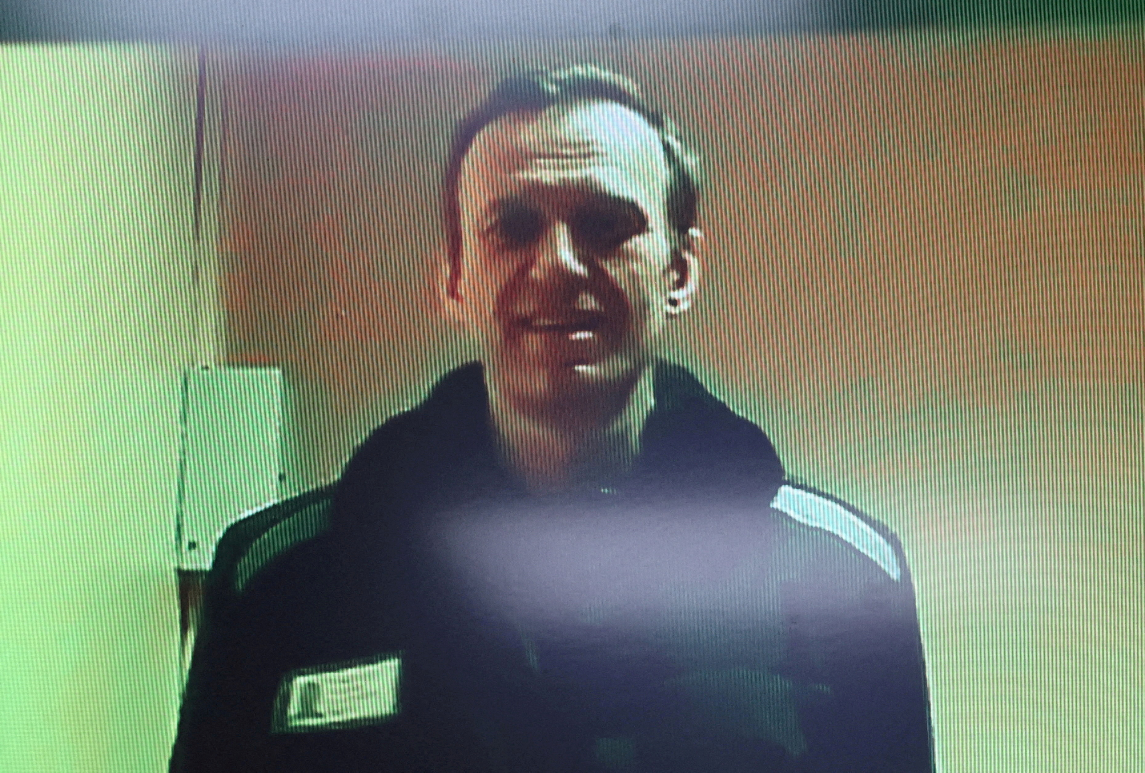 FILE PHOTO: Russian opposition leader Alexei Navalny is seen on a screen via video link during a court hearing in Moscow
