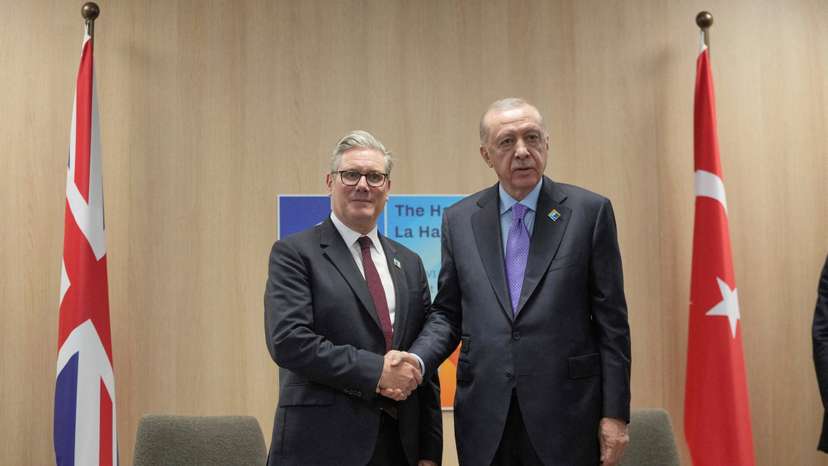 Turkey's President Recep Tayyip Erdogan and Britain's Prime Minister Keir Starmer shake hands during a bilateral meeting at the NATO summit in The Hague