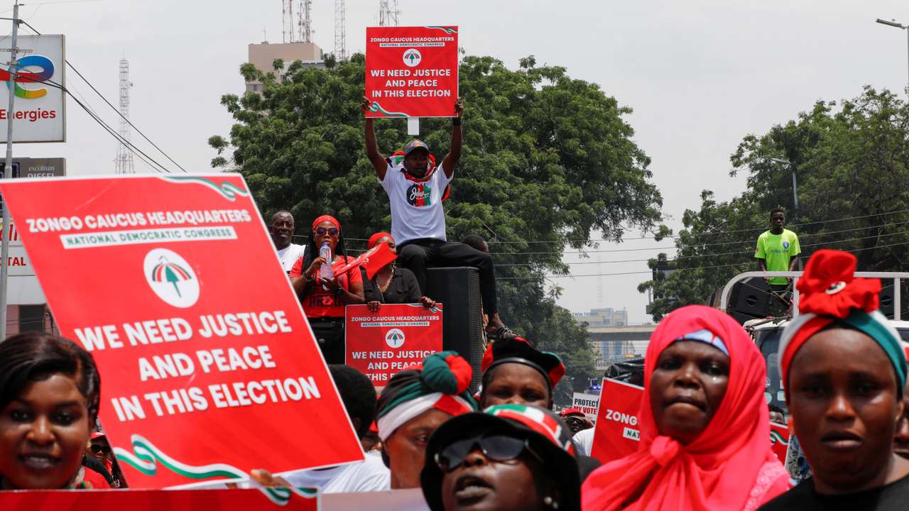 Supporters of Ghana's main NDC party protest what they suspect to be voter roll irregularities, in Accra