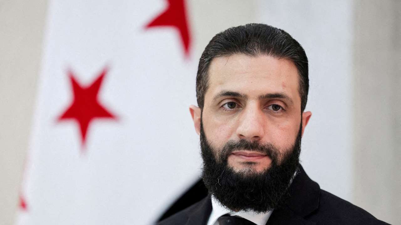 FILE PHOTO: Syria’s interim President Ahmed al-Sharaa attends an interview with Reuters
