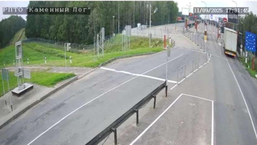 A man, believed to be Belarusian opposition politician Mikola Statkevich, sits in the no man's zone at the Lithuania border crossing