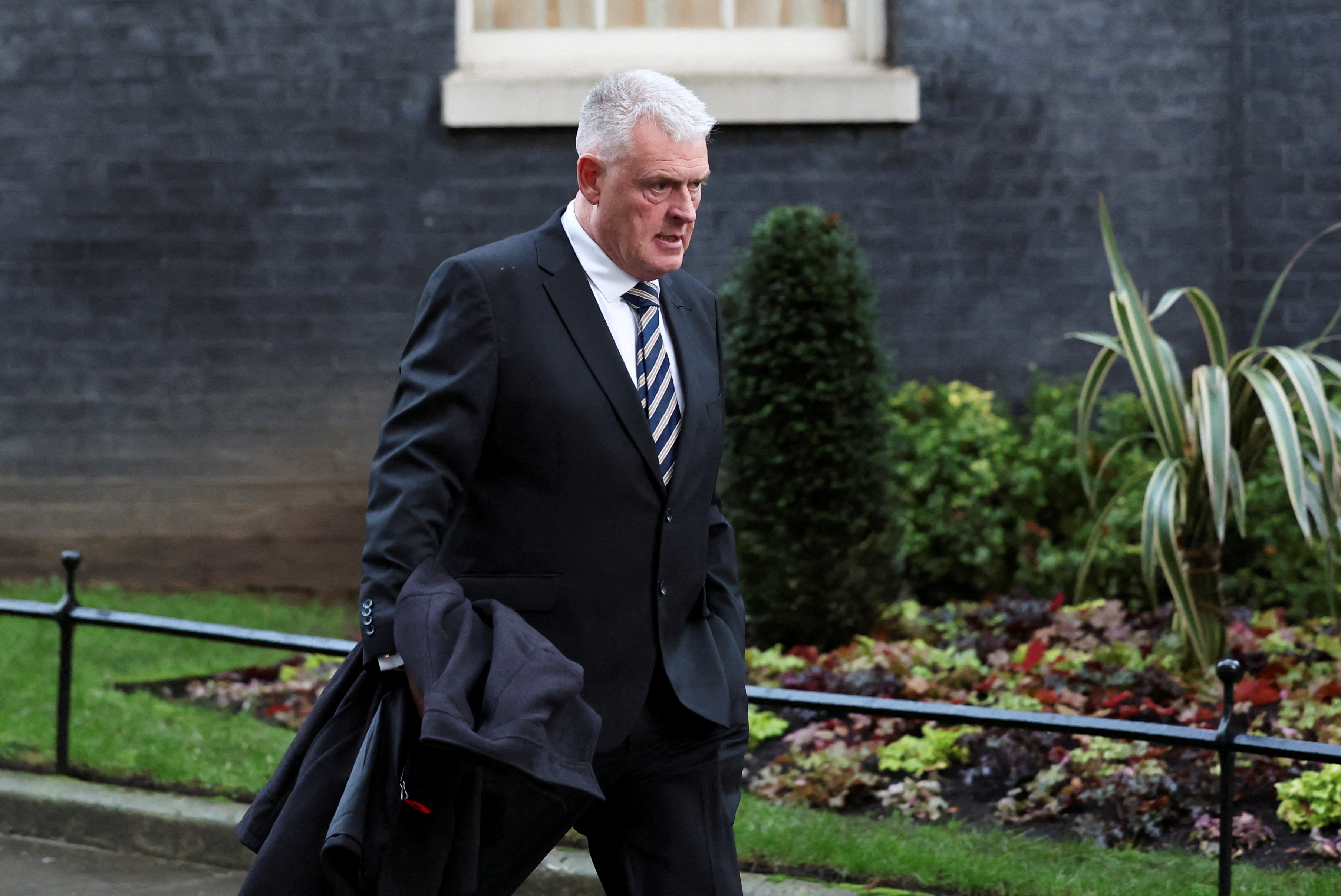 FILE PHOTO: Deputy Chairman of the Conservative Party Anderson walks at 10 Downing Street in London