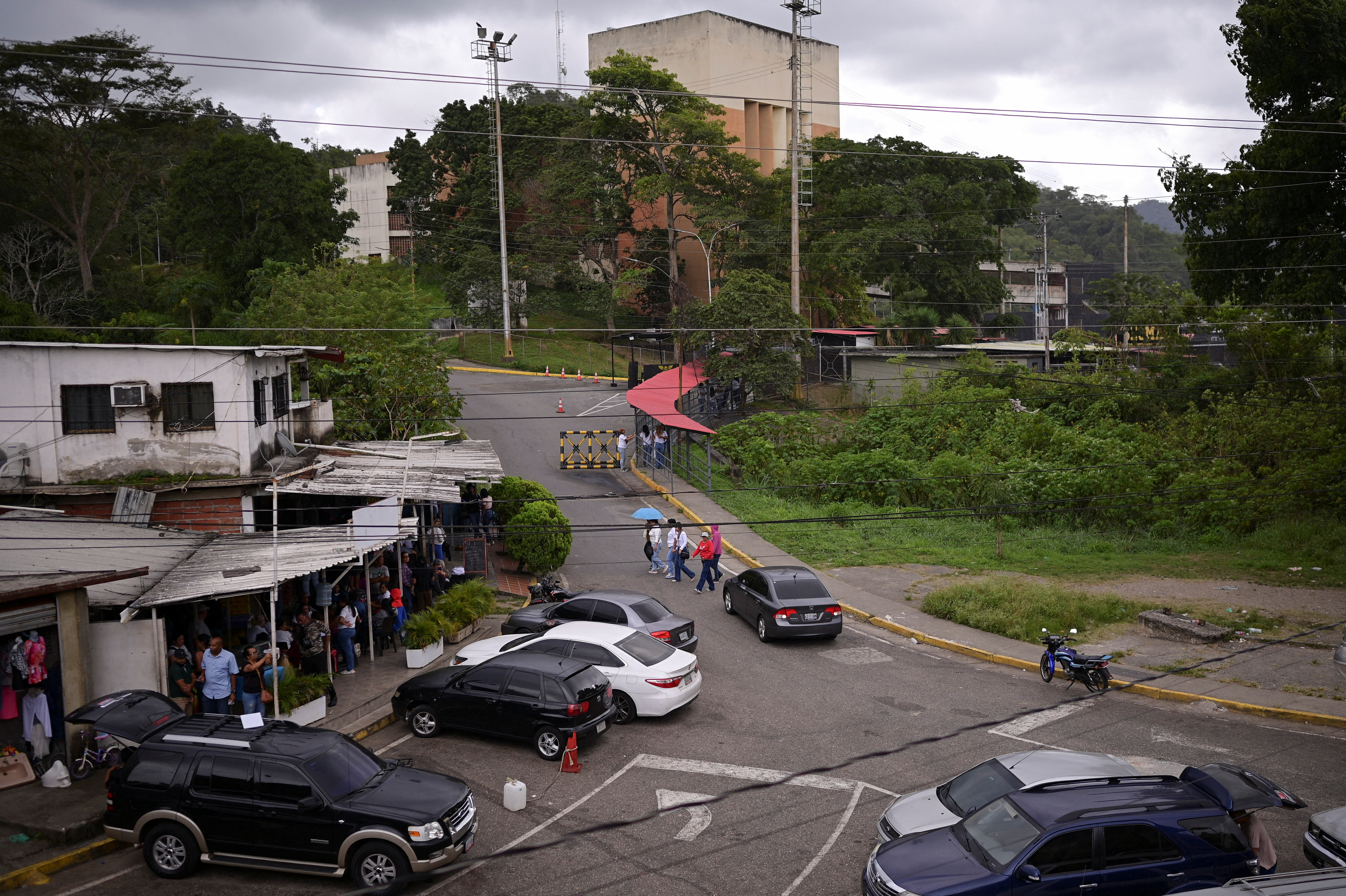 Family members of detainees wait outside the El Rodeo jail, in El Rodeo