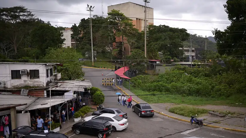 Family members of detainees wait outside the El Rodeo jail, in El Rodeo